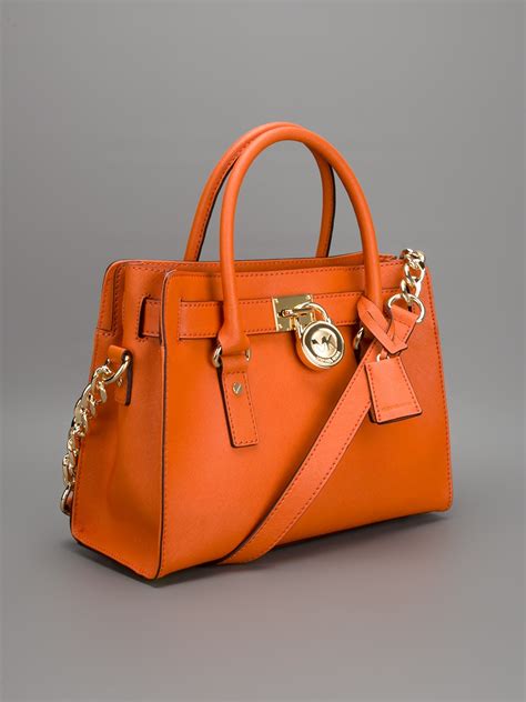 michael kors orange and white purse|Michael Kors orange handbag.